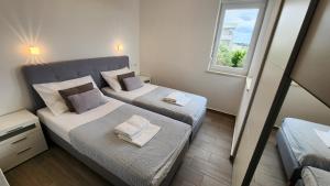 Ένα ή περισσότερα κρεβάτια σε δωμάτιο στο The Sands LUXE Pool Aparthotel 4 +27 φωτογραφίες