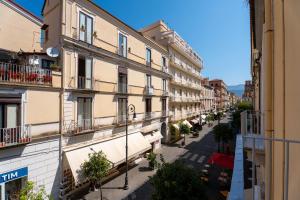 an empty street in a city with buildings at Domus Gualtieri in Sorrento