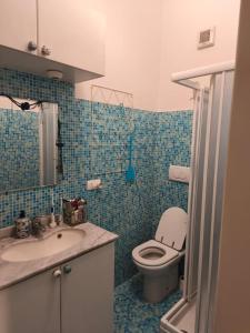 a bathroom with a toilet and a sink at Bardolino Blue in Bardolino +21 photos