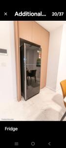 a picture of a room with a table and a refrigerator at Eaton kl,1R1B,0 Servies,500 mbps,klcc,2 pax in Kuala Lumpur