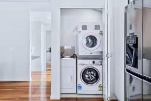 a laundry room with a washer and dryer at Park Avenue Terrace 1BR, 4km to CBD, WiFi, Park in Brisbane