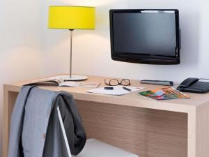 TV a/nebo společenská místnost v ubytování Aparthotel Adagio Access Nice Magnan