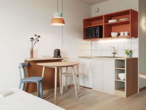 Η κουζίνα ή μικρή κουζίνα στο Aparthotel Adagio Access Toulouse Jolimont