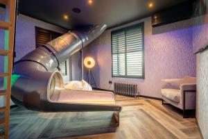 a room with a slide in the middle of a room at Brierley Club Hideaway Chic 7 Star Retreat in Rishton