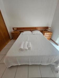 Ένα ή περισσότερα κρεβάτια σε δωμάτιο στο ap na praia de Quiaios +4 φωτογραφίες