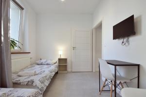 Postel nebo postele na pokoji v ubytování Apartament w Centrum Gliwic