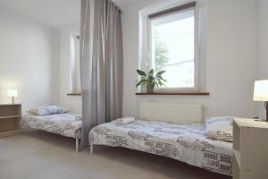 Postel nebo postele na pokoji v ubytování Apartament w Centrum Gliwic