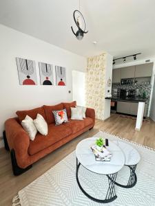 a living room with a couch and a table at Dream Nook - One Bedroom Apt in Tatu City in Tatu City