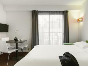 Katil atau katil-katil dalam bilik di Aparthotel Adagio Access Nantes Viarme