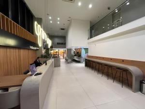 Et opholdsområde på Studio Helbor Stay Batel - Sofisticação, Conforto, Localização e Vista Privilegiada + 38 billeder