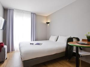 Katil atau katil-katil dalam bilik di Aparthotel Adagio Access Paris Maisons-Alfort