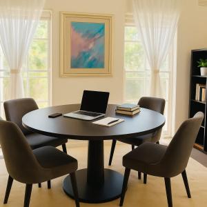 a dining room with a table with a laptop on it at Exclusive Toorak Village 3B Corporate Retreat in Melbourne