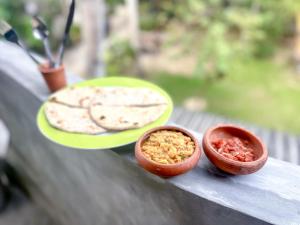 a table with two plates of food on it at The Garden in Ahangama