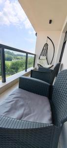 a room with two chairs and a bed on a balcony at old fortress view in Šabac