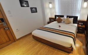 Rúm í herbergi á Elite Central Hotel Hanoi