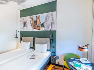 Ένα ή περισσότερα κρεβάτια σε δωμάτιο στο Hotel Ibis Lisboa Parque das Nações