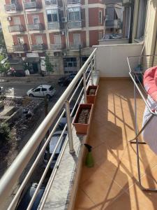 an apartment balcony with a view of a street at 1Bedroom Apt in Tirana - Close to Scanderbeg Square in Tirane