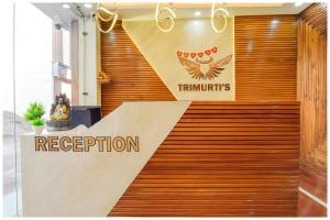 a sign on a wooden wall in a store at A PREMIUM HOTEL HARIDWAR H-E-A-V-E-N PALACE Near Mansa Devi Temple and Har ki Pauri Ganga Ghat - #Free Parking & Wi-fi - Lift Facilities - Room Service - Fully Air Conditioned Rooms - Best Hotel in Heart of Haridwar in Haridwār