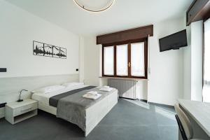 Postel nebo postele na pokoji v ubytování Da Cichin - Free Parking, Wi-Fi & AC - Vicino all'Ospedale Carle di Cuneo