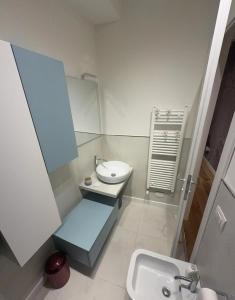 a small bathroom with a sink and a toilet at GL Suite Via Baglioni in Perugia