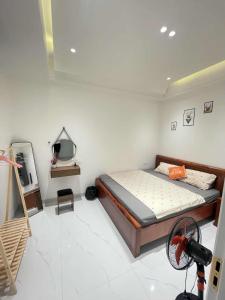 a bedroom with a bed and a television in it at Classic homestay in Thôn Trường Giang