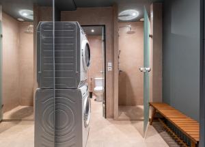 a washer and dryer in a bathroom with a toilet at House of Paralympic Athlete Mike Seitis in Rhodes Town +28 photos