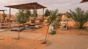 a picnic area in the middle of a desert at Desert luxury in Adrouine