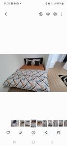 a screenshot of a bedroom with a bed in a room at L&L Apartman in Smederevska Palanka