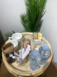 a basket with water bottles on a table at سندباد in Riyadh