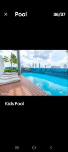 a picture of a swimming pool with the words podyss pool at Eaton KL,1R1B,0 Service,500mbps,KLCC,2 pax in Kuala Lumpur