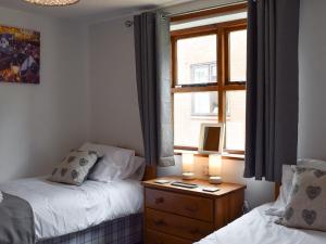 Voodi või voodid majutusasutuse Keel Cottage toas