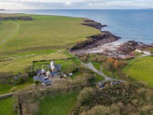 an aerial view of a house next to the ocean at Cranford-Cottage in Saint Brides