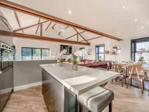 a kitchen and dining room with a table and chairs at North Plain Barn in Bowness-on-Solway