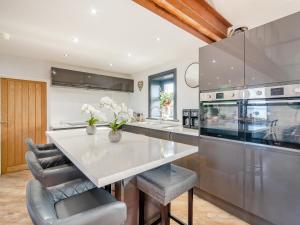 a kitchen with a large stainless steel counter top at North Plain Barn in Bowness-on-Solway