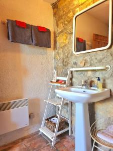 a bathroom with a sink and a mirror at Provence villa with heated pool and amazing view in Montauroux