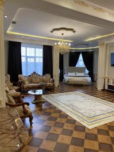a large living room with a bed and a couch at Hotel Madonna SPA in Qaskeleng +48 photos