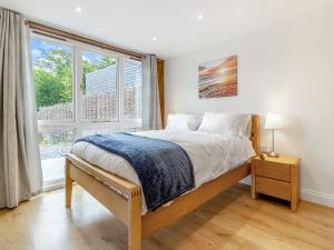 a bedroom with a bed and a large window at Orchard Barns - Uk47200 in Stapleton