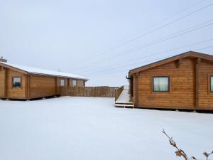 a couple of buildings with snow on the ground at Coo Lodge - Uk48430 in Falkirk
