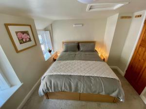 a bedroom with a large bed in a room at T'owd Man's Cottage in Bonsall +7 photos