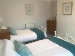 Ένα ή περισσότερα κρεβάτια σε δωμάτιο στο Ivy Cottage +8 φωτογραφίες