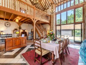 a dining room with a table with flowers on it at St Mary's Chapel in New Buckenham
