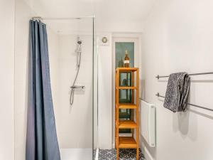 a shower with a glass door and a ladder at North Lake Chapel in West Worlington
