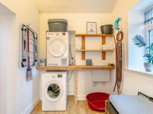 a laundry room with a washer and dryer at North Lake Chapel in West Worlington +51 photos
