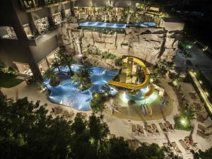 an overhead view of a water park at night at Mercure Pattaya Ocean Resort in Pattaya Central