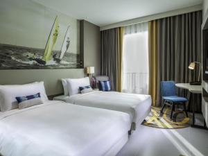 Katil atau katil-katil dalam bilik di Mercure Pattaya Ocean Resort
