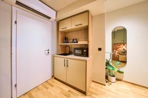 a kitchen with a door leading into a room at Hotel Karol in Vienna