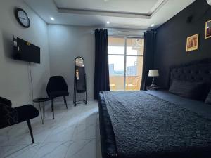 Postel nebo postele na pokoji v ubytování Islamabad Apartment + 7 fotografií