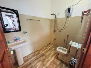 a bathroom with a toilet and a sink and a shower at Belmount Ella in Ella +87 photos