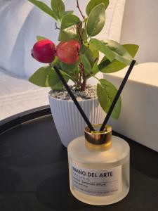 a small potted plant in a pot on a table at Lay House in Suwon