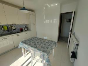 a small kitchen with a table in a room at Iride in Portovenere